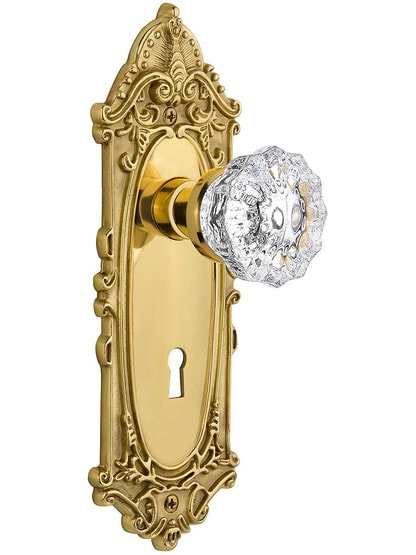 Largo Door Set with Fluted-Crystal Glass Knobs and Keyhole Single Dummy in Polished Brass.